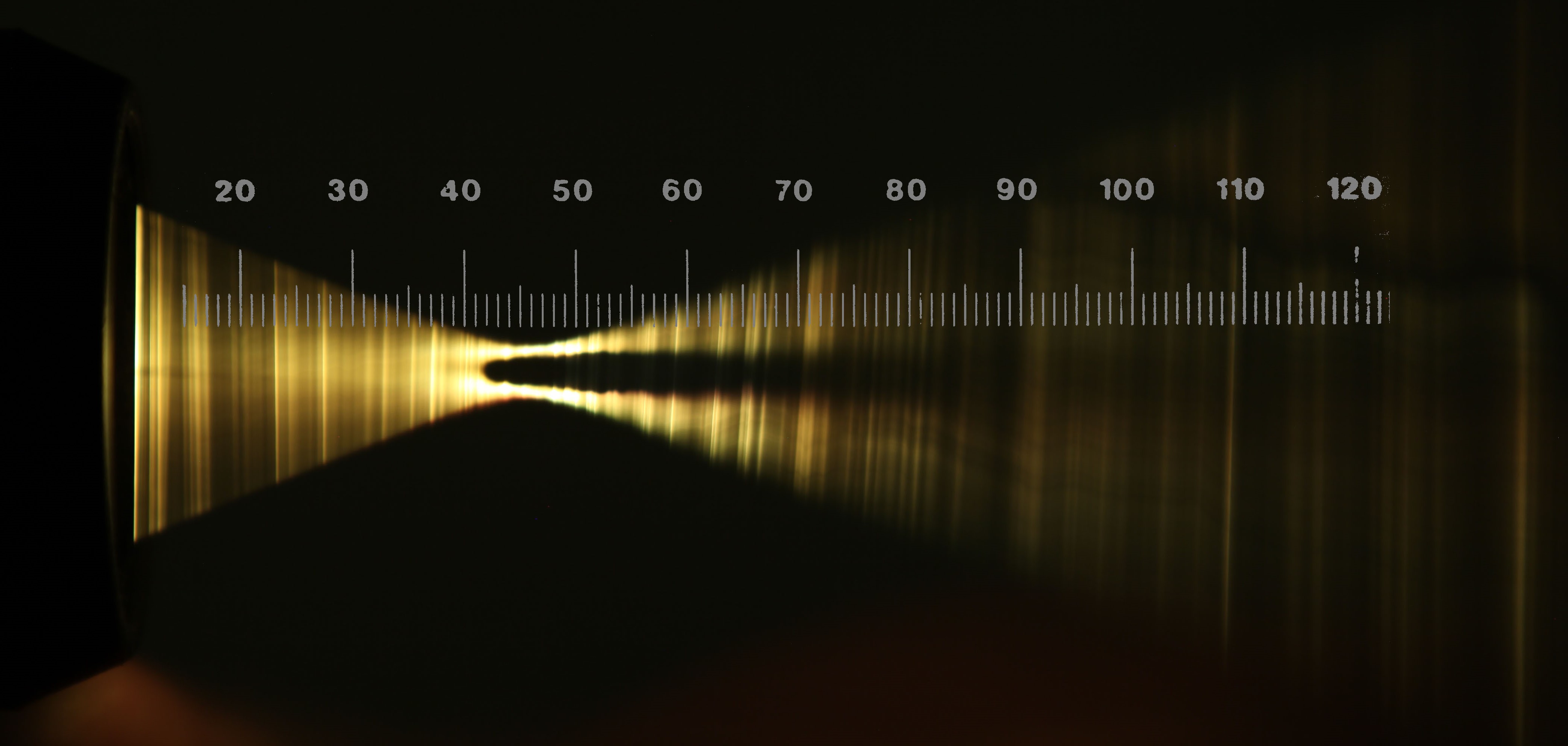 Photographing a light beam by dodging with a handheld white thread